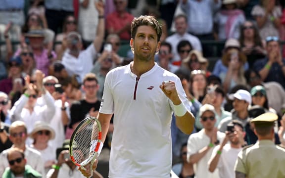 Britain's Cameron Norrie celebrates after victory over US player Frances Tiafoe at the end of their men's singles second round tennis match on the third day of the 2025 Wimbledon Championships at The All England Lawn Tennis and Croquet Club in Wimbledon, southwest London, on July 2, 2025. (Photo by Glyn KIRK / AFP) / RESTRICTED TO EDITORIAL USE