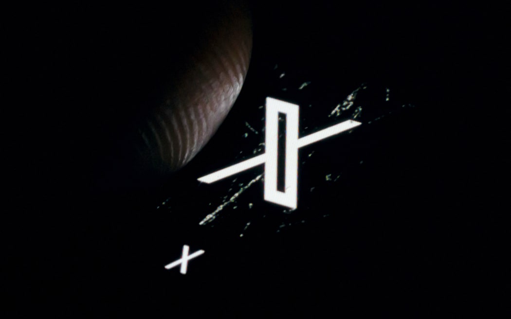 The logo of the microblogging service X (formerly twitter) of the company X Corp is shown on the display of a smartphone.