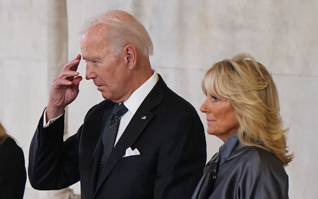 US President Joe Biden and First Lady Jill Biden pay their respects as they view the coffin of Queen Elizabeth II, as it lies in State inside Westminster Hall, at the Palace of Westminster in London on September 18, 2022.