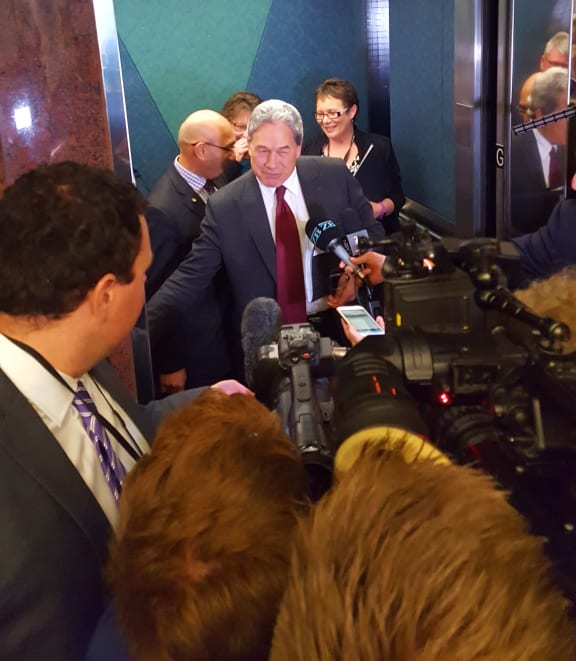 Mr Peters giving a press conference in an elevator.