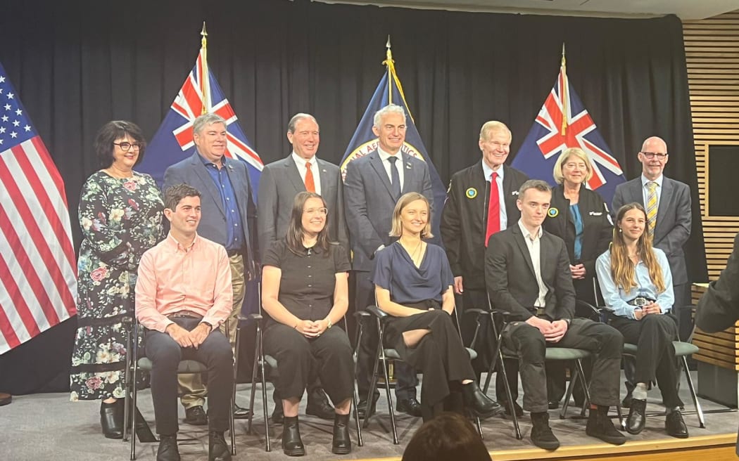 Students receive space scholarships - lineup includes NASA's deputy administrator Colonel Pam Melroy, 2nd from right in back row and her boss NASA administrator Bill Nelson, third from right in back row.