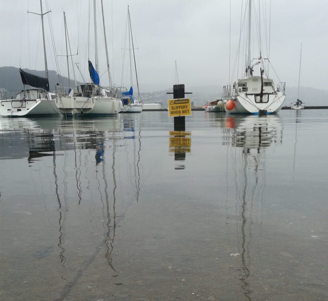 Slippery when wet sign under water