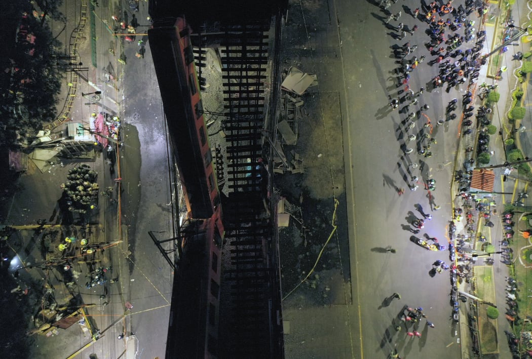 An aerial view shows rescue workers at the site of a metro train accident.
