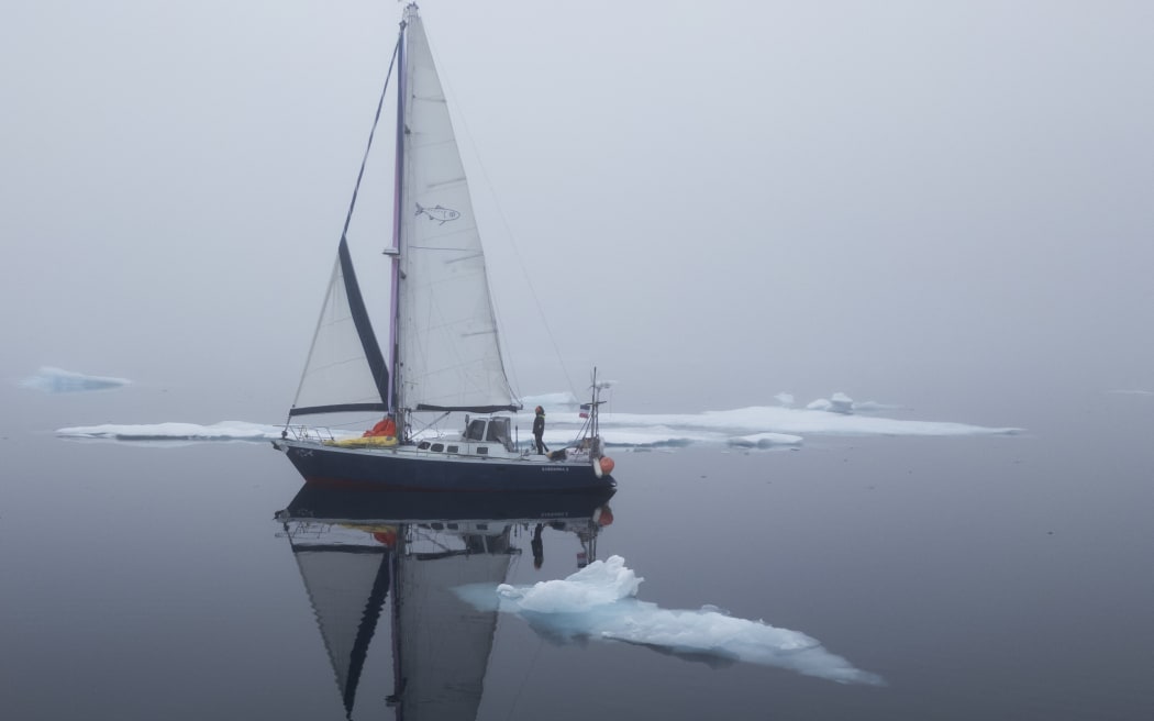 Brazilian sailor Tamara Klink during her Arctic voyage, on her sailboat 'Sardinha 2' in the remote western region of Nunavut, Canada, near the Beaufort Sea.