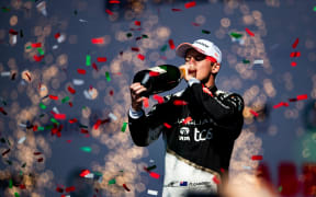 New Zealand driver Nick Cassidy celebrates at a Formula E race.