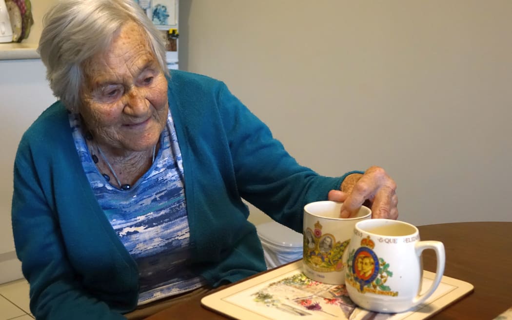 Betty Suttron in her Petone retirement unit with her prized royal mugs.