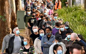Sydneysiders queue outside a Covid-19 vaccination centre in Sydney on June 24, 2021.