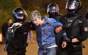 Law enforcement officers detain a protester during a rally against presidential election results in Minsk, Belarus.