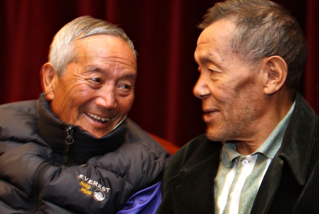 Ang Rita (right) speaks to Nepalese mountaineer Min Bahadur.