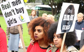 Two protesters outside Parliament