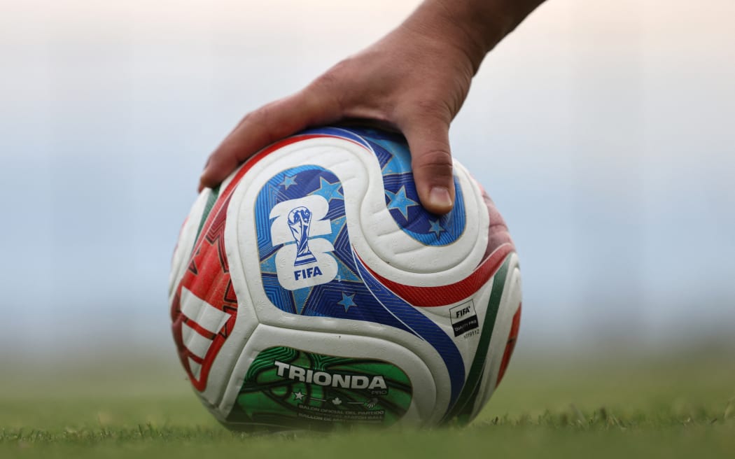 A member of the Iranian national football team reaches for a FIFA official World Cup 2026 ball during a training session at their base camp in Antalya on May 19, 2026. Iran’s national football team arrived in Turkey on May 19, 2026 for a training camp and to complete visa applications ahead of the 2026 World Cup, AFP correspondents said. (Photo by Oner SAN / AFP)