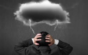 Depressed man with dark cloud rain lightning over his head.