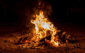 Bright beautiful bonfire at night, camping.