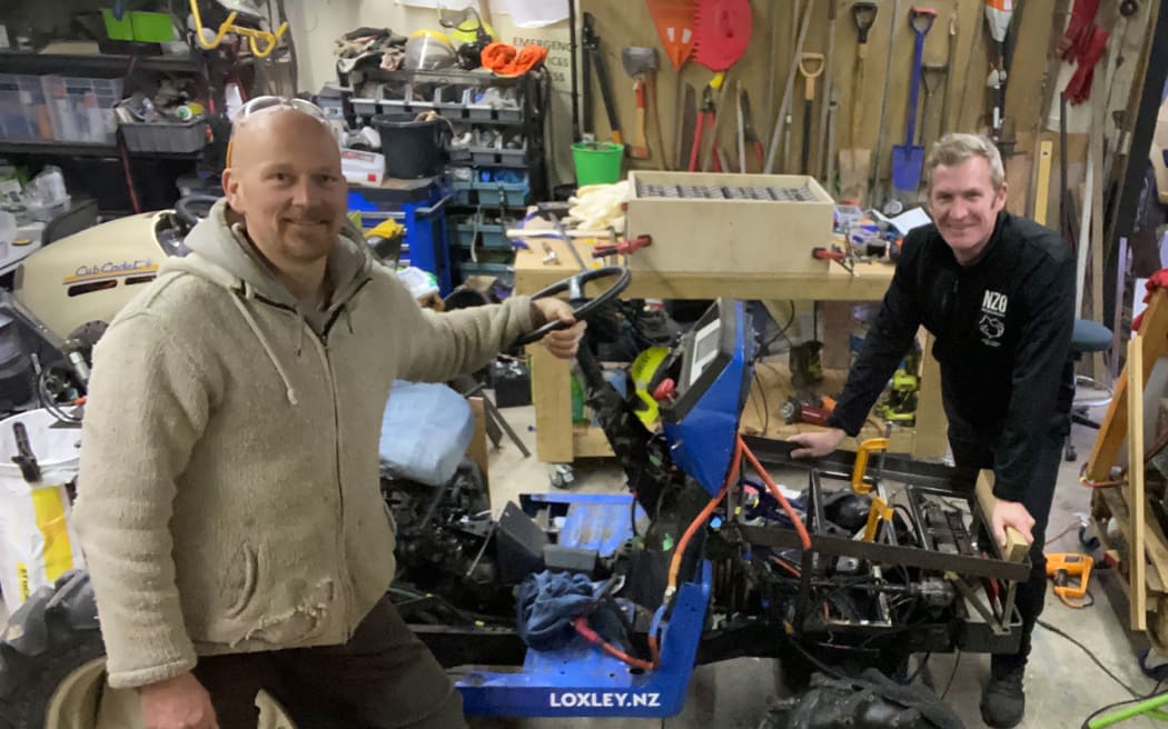 Duncan from Loxley Tractors, left, and Forest Lodge Orchard manager Euan White with what is thought to be world's first electric foliage sprayer