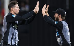 Mitchell Santner and Kane Williamson celebrate the wicket of Dhawan.
New Zealand Black Caps v India. Twenty20 International cricket. 3rd T20. Seddon Park, Hamilton, New Zealand. Sunday 10 February 2019 © Copyright photo: Andrew Cornaga / www.photosport.nz