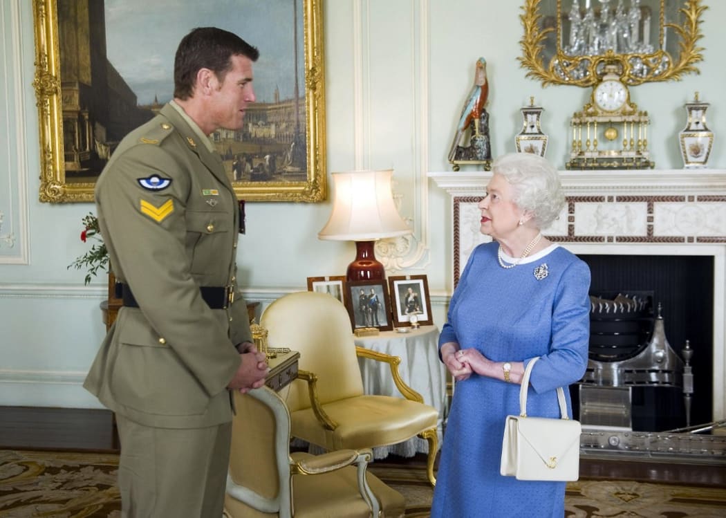 Britain's Queen Elizabeth (R) greets Australian Corporal Ben Roberts-Smith who was recently honoured with the Victoria Cross, during an audience at Buckingham Palace. (File)