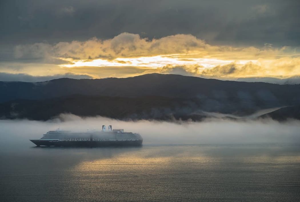 A ship sails through fog in Wellington Harbour on Wednesday.