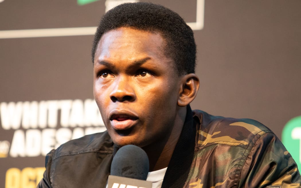 Israel Adesanya speaks at a UFC press conference in 2019.
