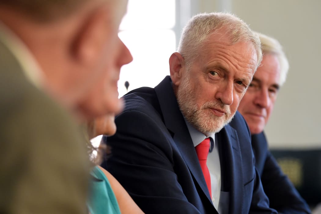 Britain's opposition Labour Party leader, Jeremy Corbyn, poses for a photograph as he prepares to meet with leaders of Britain's other political parties to discuss options for Brexit, in Portcullis House, central London on August 27, 2019.