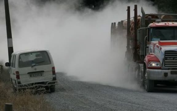 logging truck on gravel roadno captions Northland