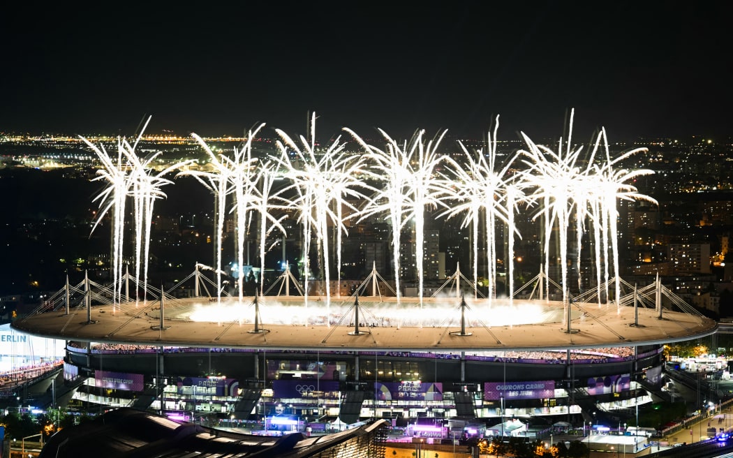 Fireworks illuminate the sky during the closing ceremony of the Paris 2024 Olympic Games at the Stade de France, in Saint-Denis, in the outskirts of Paris, on August 11, 2024. (Photo by Mauro PIMENTEL / AFP)