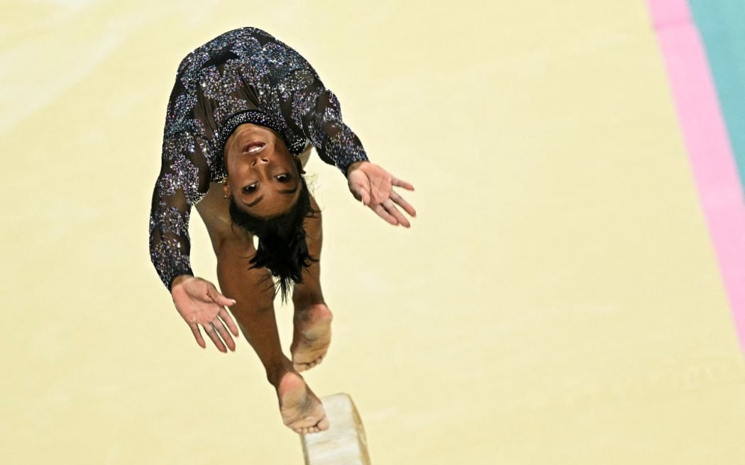 US' Simone Biles competes in the balance beam event of the artistic gymnastics women's qualification during the Paris 2024 Olympic Games at the Bercy Arena in Paris, on July 28, 2024. (Photo by Gabriel BOUYS / AFP)