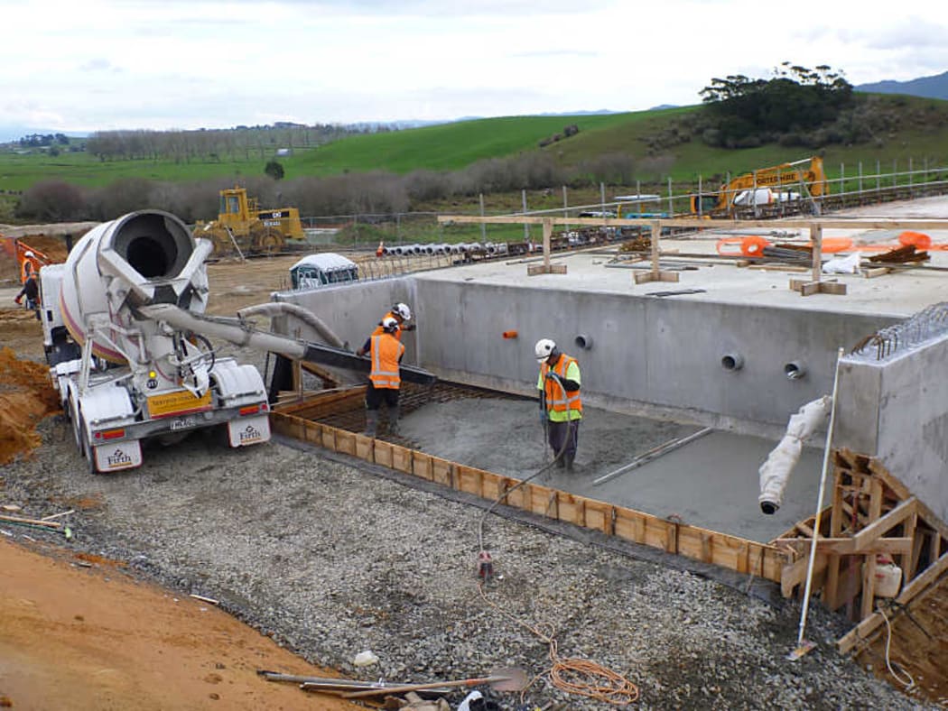 Workers lay down steel for the Huntly Bypass.