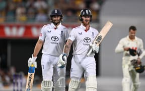 England batsmen Joe Root and Ben Stokes leave the field at the end of the second session on Day 1 of the Second Men’s Ashes Test between Australia and England at The Gabba in Brisbane, Thursday, December 4, 2025. (AAP Image/Dave Hunt) NO ARCHIVING, EDITORIAL USE ONLY, IMAGES TO BE USED FOR NEWS REPORTING PURPOSES ONLY, NO COMMERCIAL USE WHATSOEVER, NO USE IN BOOKS WITHOUT PRIOR WRITTEN CONSENT FROM AAP