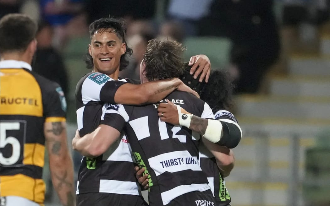 Hawke's Bay players celebrate Le Roux Malan's try.