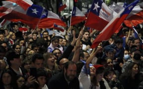 People rejecting the new constitution draft celebrate after knowing the first results of the referendum vote, in Santiago, on 4 September, 2022.