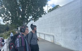 UC Arts Digital Lab manager Kaspar Middendorf and Our Stories director Kris Herbert test the Earthquake Stories Walk, which was developed to bring the CEISMIC audio archive to life in the central city.
