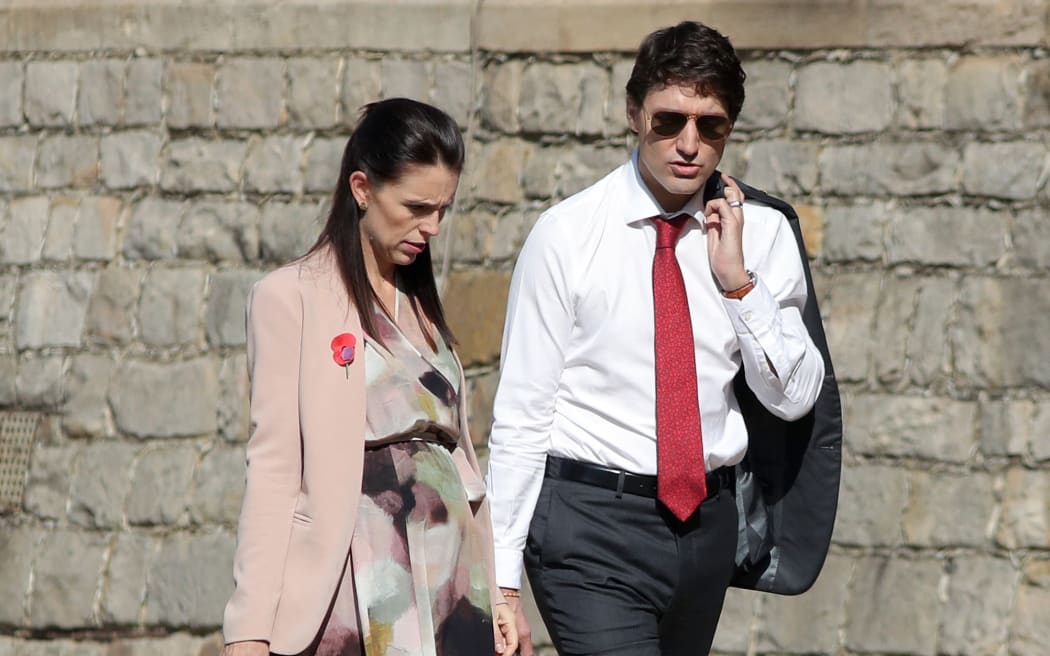 Prime Minister of New Zealand Jacinda Ardern talks with Prime Minister of Canada, Justin Trudeau as they arrive at Windsor Castle for a Commonwealth Heads of Government meeting (CHOGM) retreat in Windsor, west of London on April 20, 2018. (Photo by Andrew Matthews / POOL / AFP)