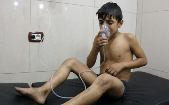 A Syrian boy suffering from breathing difficulties is treated at a make-shift hospital in Aleppo after regime helicopters dropped barrel bombs on the rebel-held Sukkari neighbourhood in Aleppo.