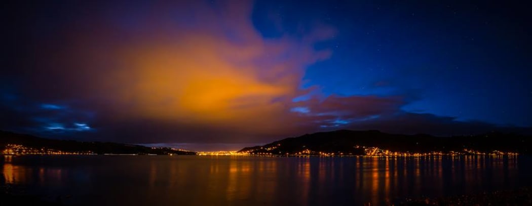 Bright clouds and light reflections on Otago Harbour in Dunedin