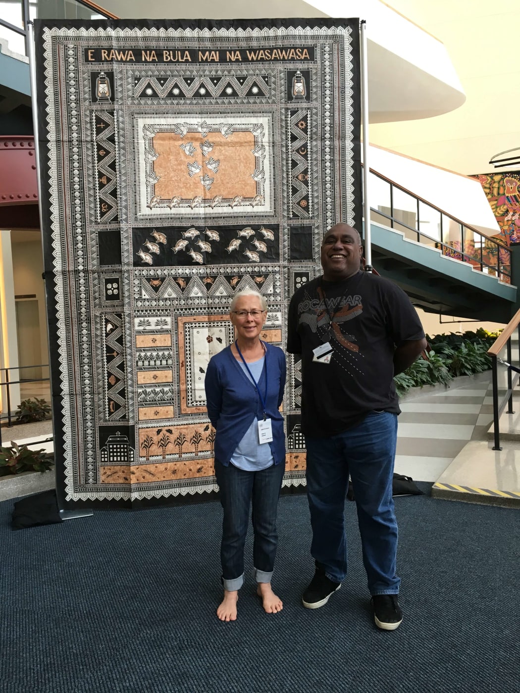 Robin White with Semi Koroilavesau at the UN in front of E Rawa Na Bula Mai Na Wasawasa.