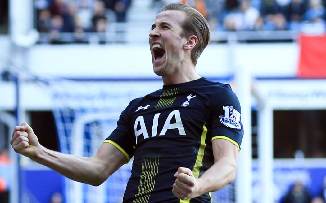The Tottenham striker Harry Kane celebrates scoring a goal.