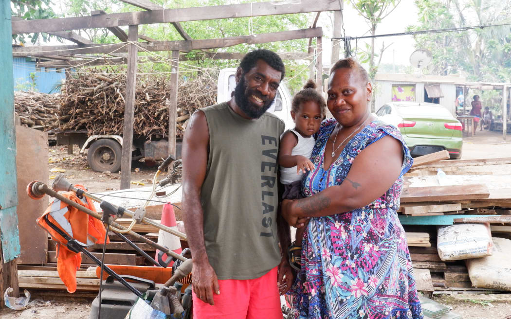 Frederica Atavi (right) with her son and husband Tom, feels the post-cyclone response has been slow.