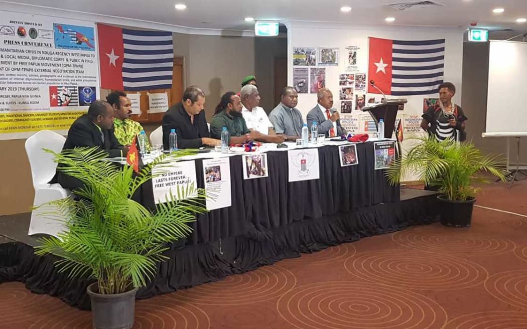 Governor of Papua New Guinea's National Capital Powes Parkop (with mic) speaks at OPM (Free Papua Movement) press conference in Port Moresby 31 January 2019