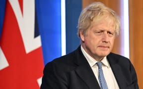Britain's Prime Minister Boris Johnson attends a press conference in the Downing Street Briefing Room in central London on May 25, 2022, following the publication of the Sue Gray report. - UK Prime Minister Boris Johnson rejected calls to resign after an inquiry Wednesday found that he presided over a culture of lockdown-breaking parties that featured drunken fighting among staff. Johnson is among dozens of people in Downing Street who have received police fines for breaching Covid regulations since 2020 -- making Number 10 the most penalised address in the entire country. (Photo by Leon Neal / various sources / AFP)