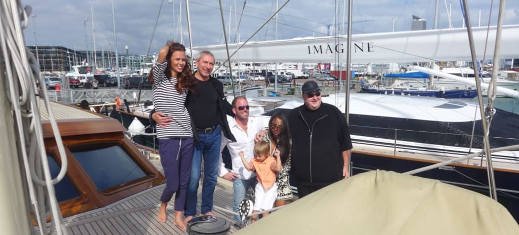 Mikhail Khimich with his girlfriend, Belarussian model Maria Dzidirava, and Kim Dotcom on Khimich's super yacht Thalia.