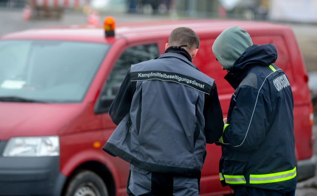 Members of the bomb disposal work at the scene where the unexploded bomb was discovered near Berlin.