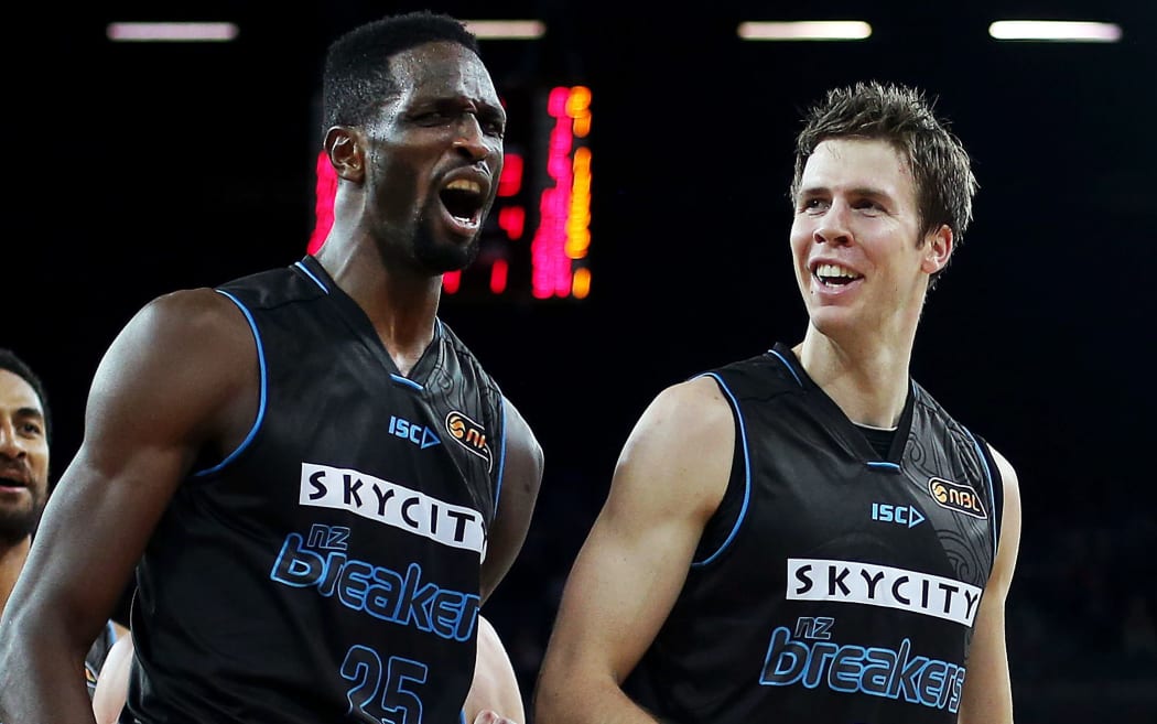 Ekene Ibekwe of the Breakers celebrates with teammates Tom Abercrombie after his put back dunk. November 2014.