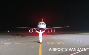 A plane arrives at Vanuatu Airport under strict Covid-19 prevention protocols. April 2020