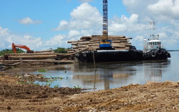 Logs loaded onto barge at Kanduanum on Sepik River; Turubu SABL, East Sepik Province, PNG.