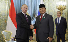 Russia's President Vladimir Putin (L) shakes hands with Indonesia's President-elect Prabowo Subianto as Russia's Foreign Minister Sergei Lavrov (R) looks on during a meeting at the Kremlin in Moscow on July 31, 2024. (Photo by Maxim Shemetov / POOL / AFP)