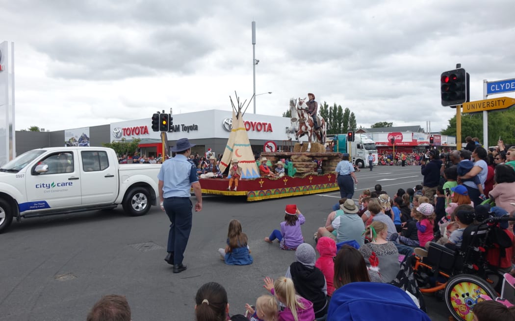 The Ojibwe costumes were removed from the float after complaints, but the cowboys and horses remained.