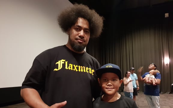 Peleti Oli, with his son Jesiah Oli, hopes to inspire others after his inclusion in the Flaxmere Heroes Calendar.