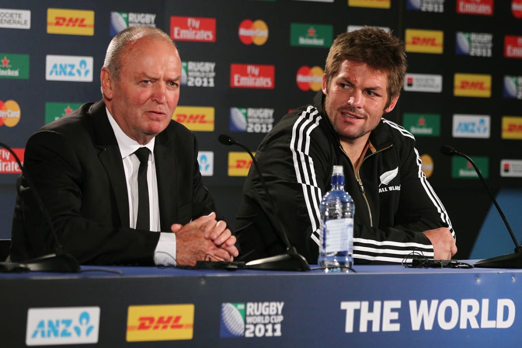 All Blacks' head coach Graham Henry and captain Richie McCaw talk to the media after a pool match against France in the 2011 Rugby World Cup.