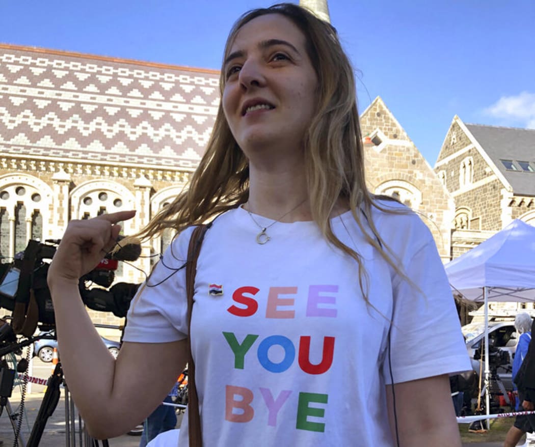 Aya Al-Umari wears the T-shirt that her brother, Hussein Al-Umari, 35, teased her about the last time she saw him, before he was killed on March 15 in the attack at the Al Noor mosque in Christchurch, New Zealand, Tuesday, March 19, 2019. (AP Photo/Juliet Williams)