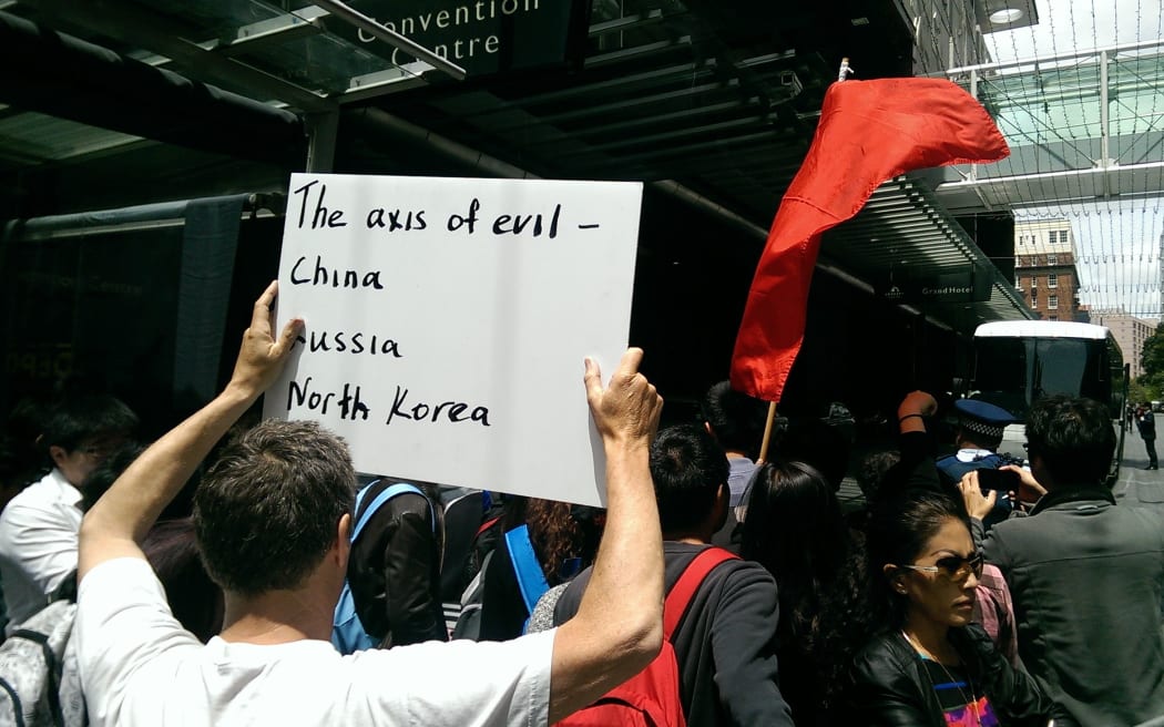 Others protested Xi Jinping's arrival.